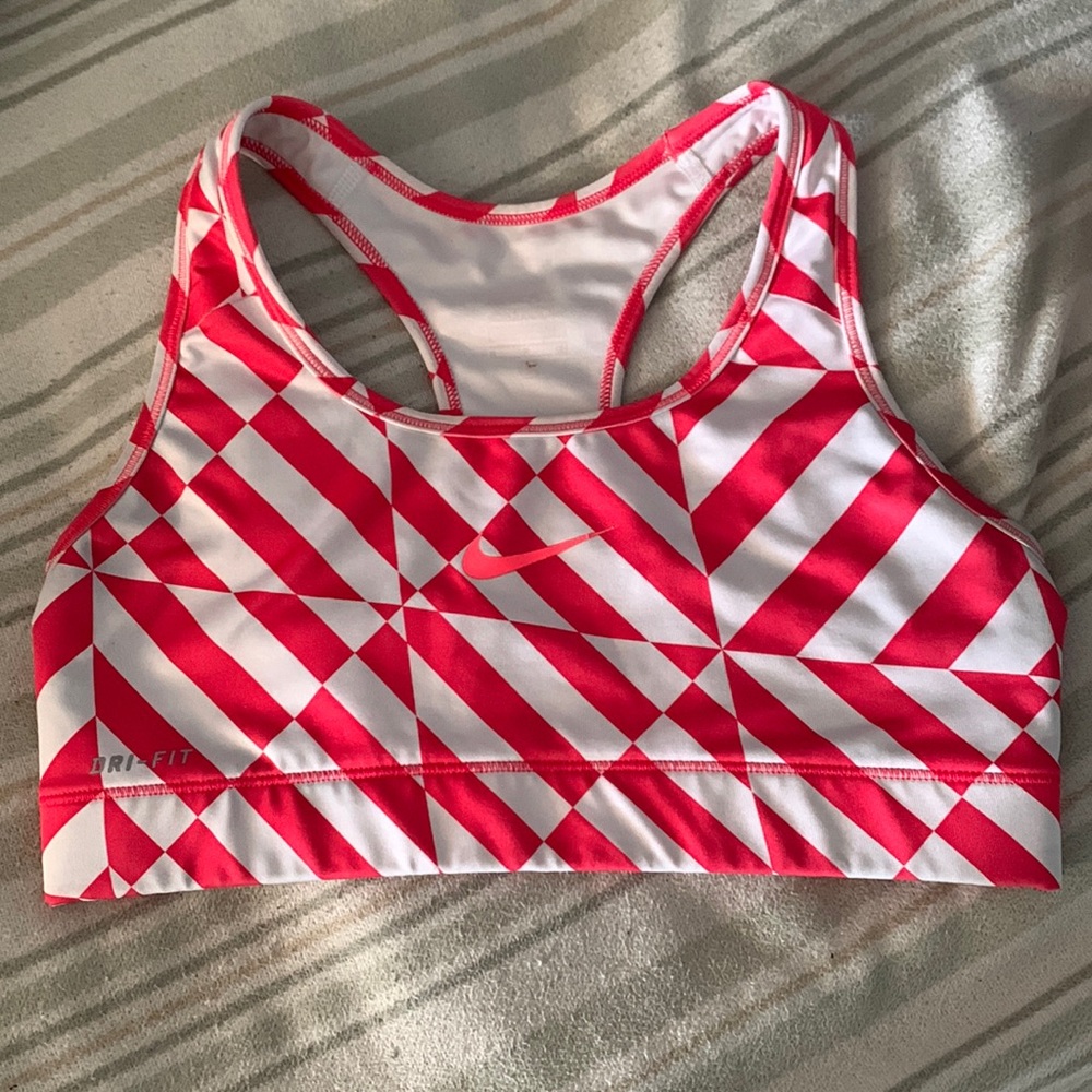 Pink and white Nike sports bra